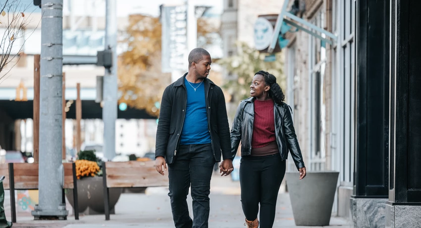 LMCU members walking on a suburban sidewalk on a sunny day.