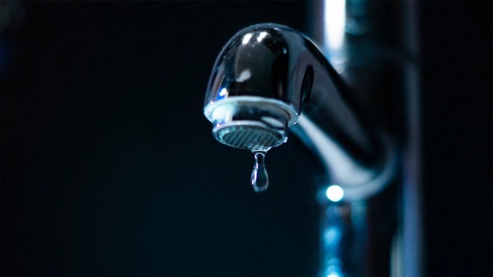 Stock image of a tap dripping for Vocus Blog - The hacker that tried to poison town's water supply
