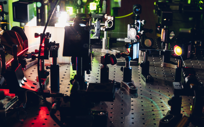 Electronics, lenses and lasers set up for an experiment