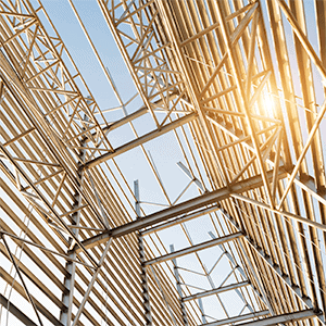 Sunlight filtering through beams of a steel framework