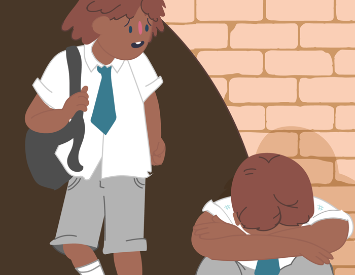 A child sitting on the ground with their head in their arms. Another child approaches them looking concerned.