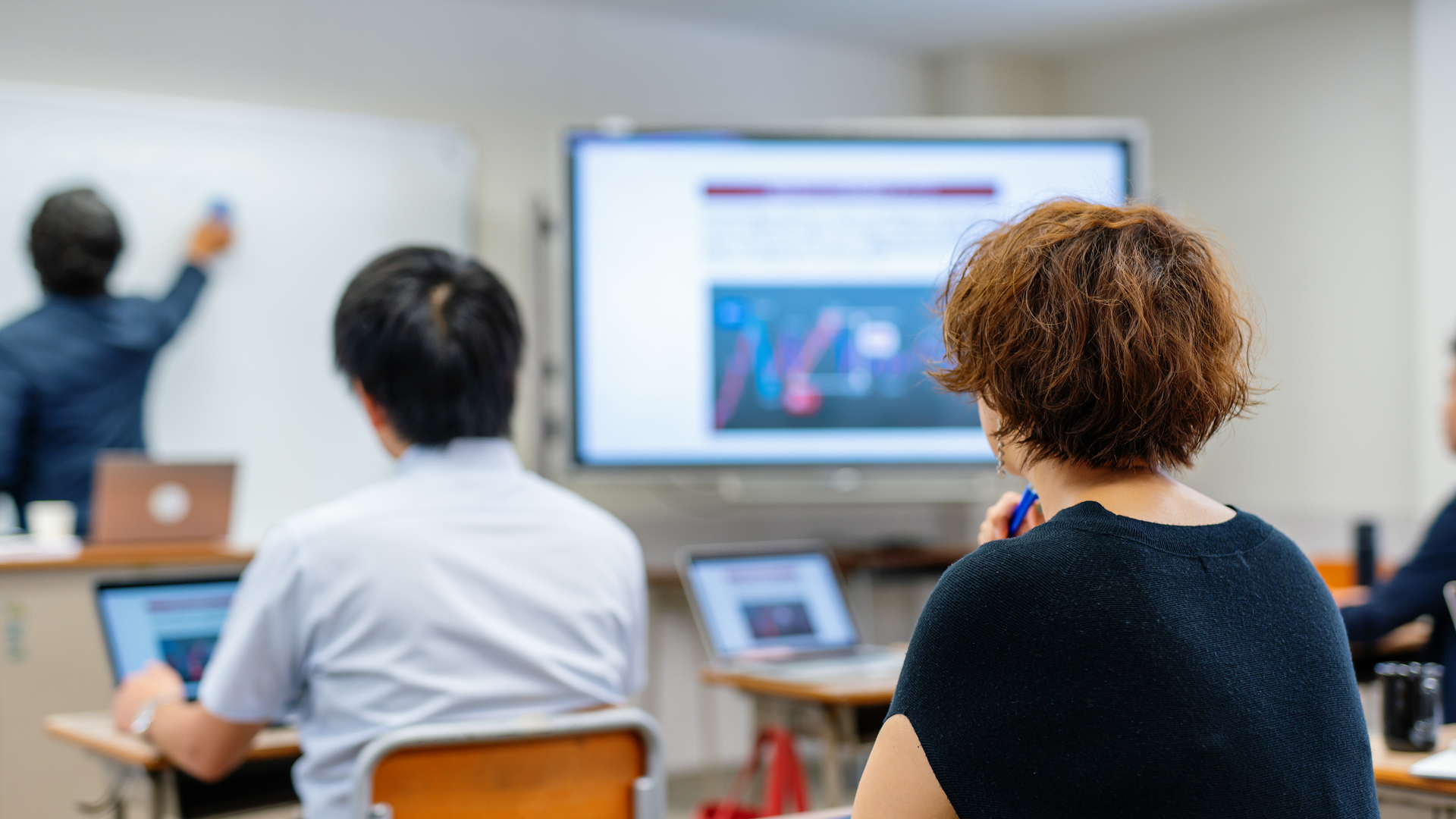 Mid adult woman in a continuing education class at a community college or university