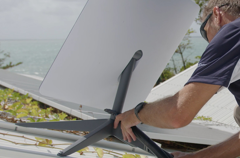 An image of a customer installing a Vocus Satellite Starlink dish