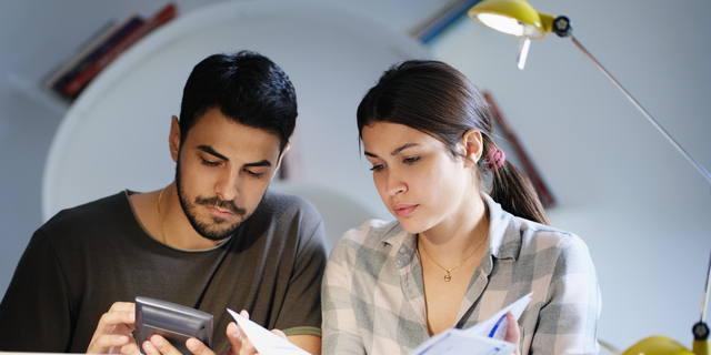 Man and Woman Worried For Taxes And Family Budget