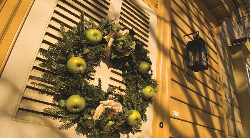 A wreath with green apples on a window in Colonial Williamsburg