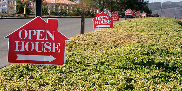 open house signs lined up in the streets