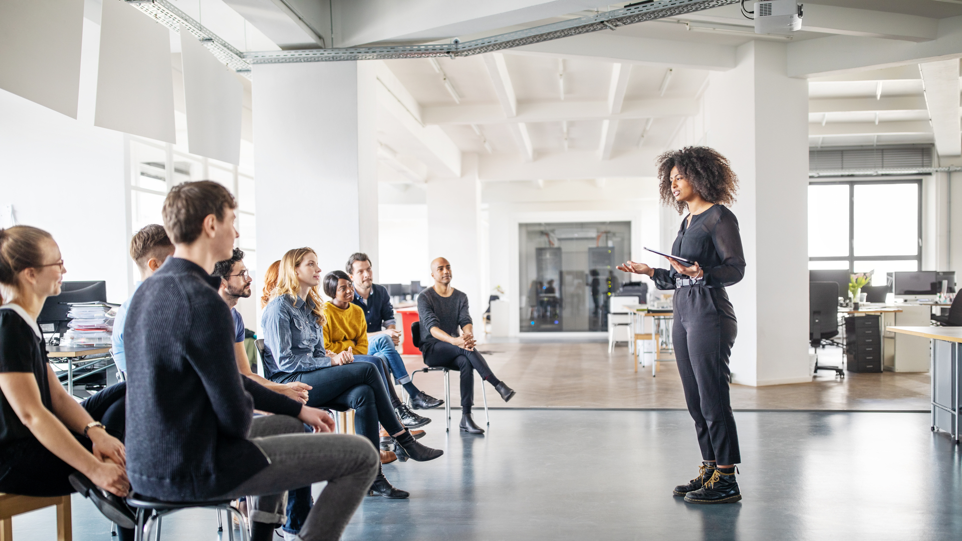 Woman addressing her team