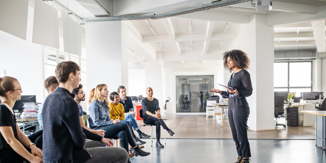 Woman addressing her team