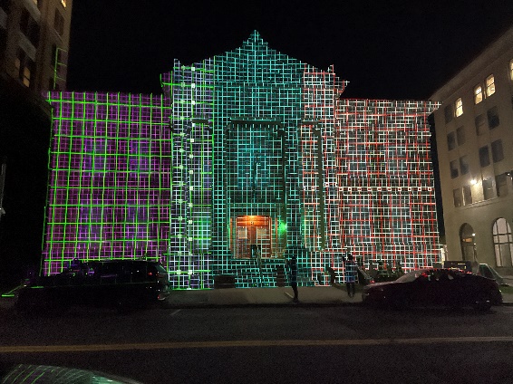 A building with lights on itDescription automatically generated