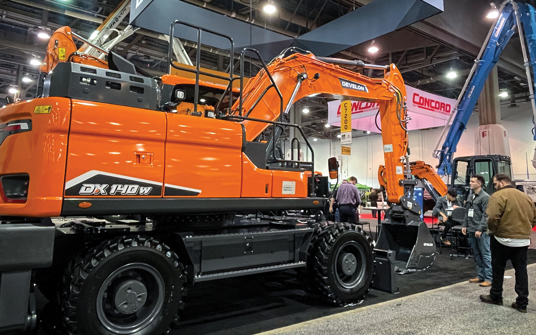 A DEVELON DX140W-7 wheel excavator on display during World of Concrete.