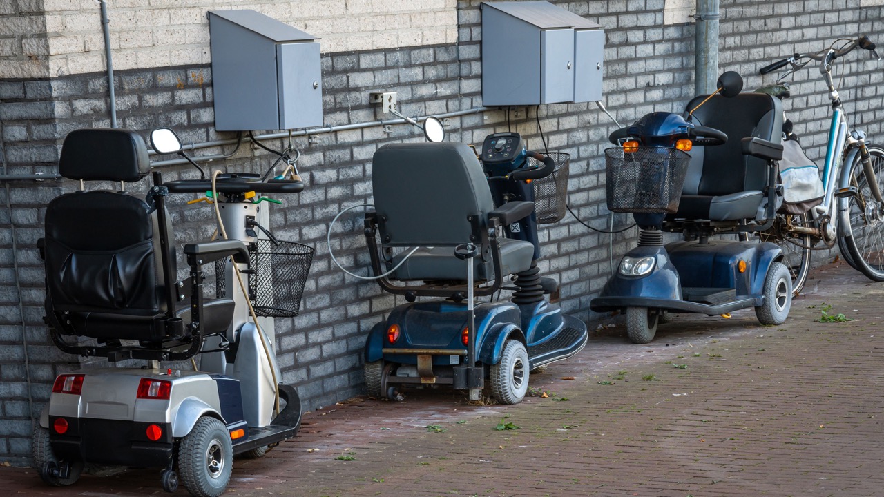 locked-powered-wheelchair-parked-outside-of-the-house