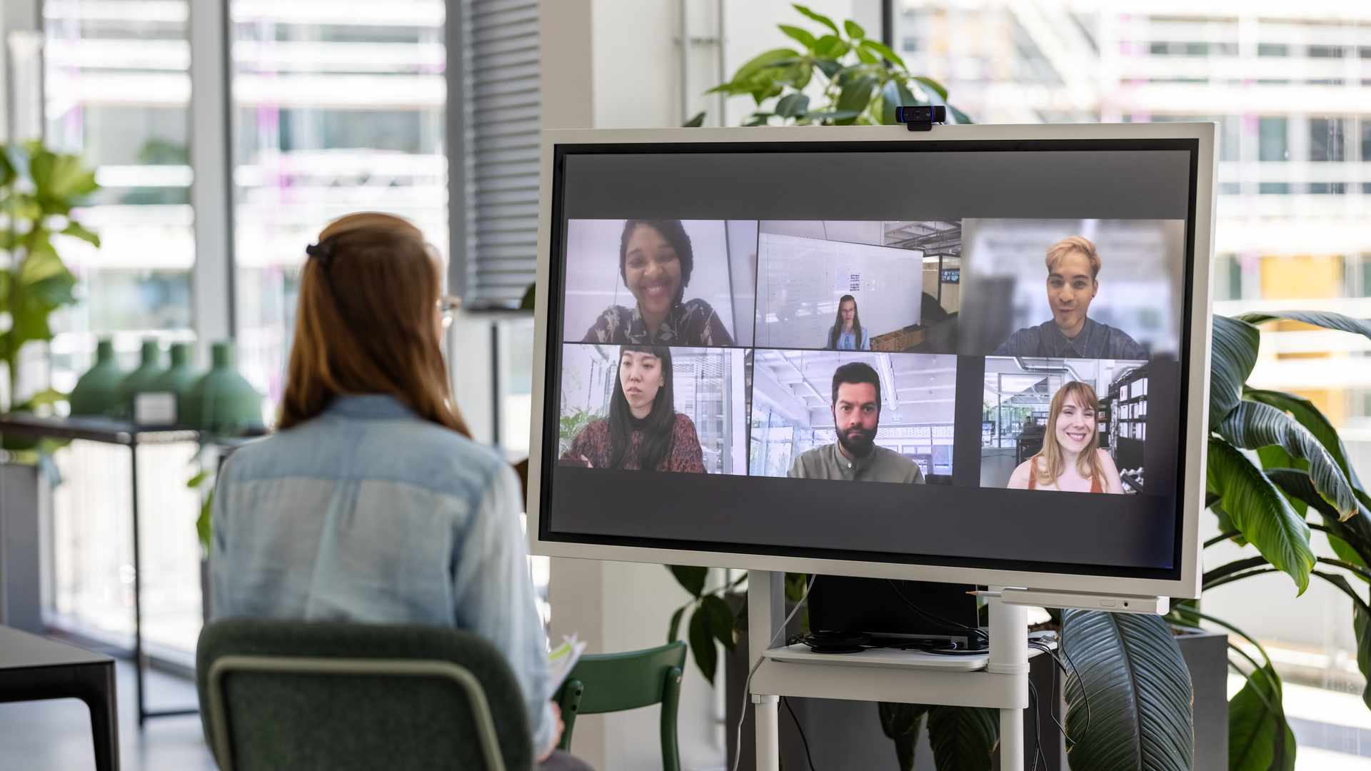 Woman having online meeting with team