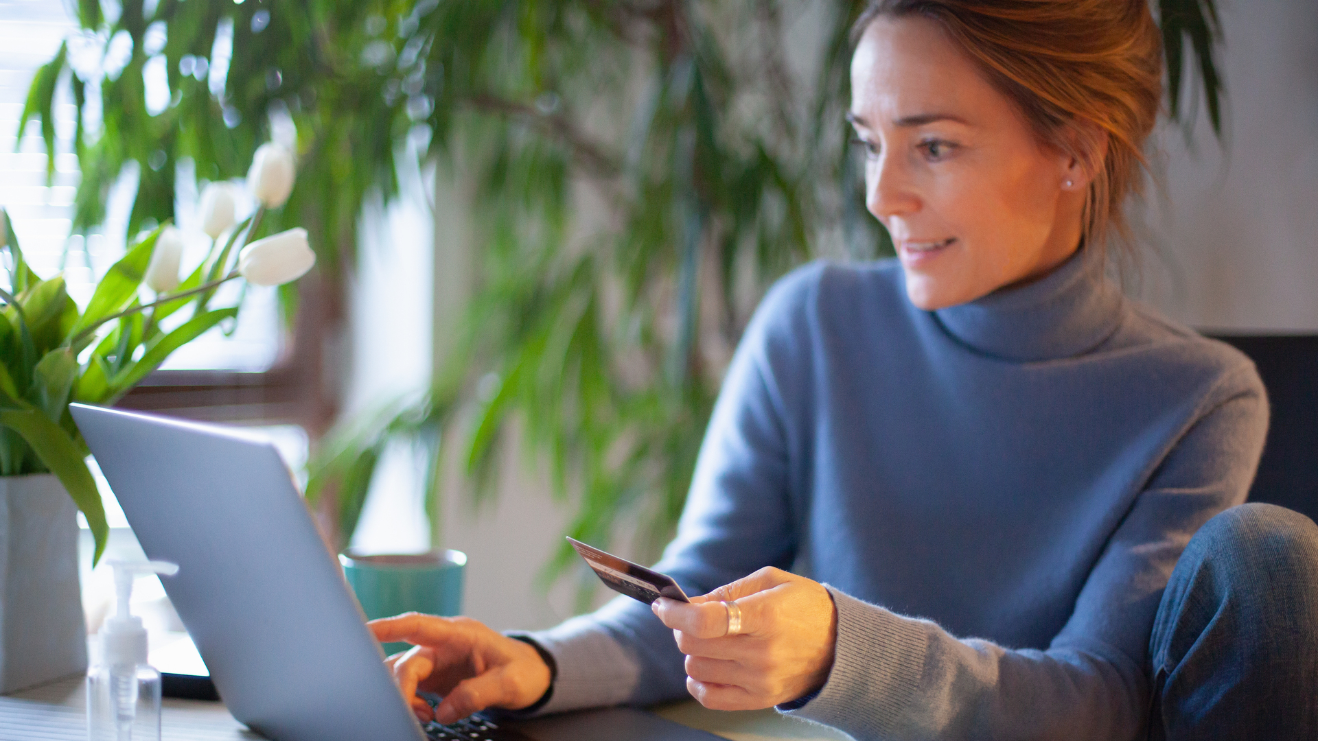 Woman using credit card for online shopping