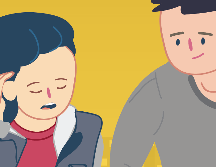 An adult helping a young person who is looking down and sad.
