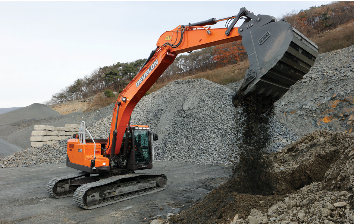 The new DEVELON -9 Series crawler excavator digging dirt on a job site.