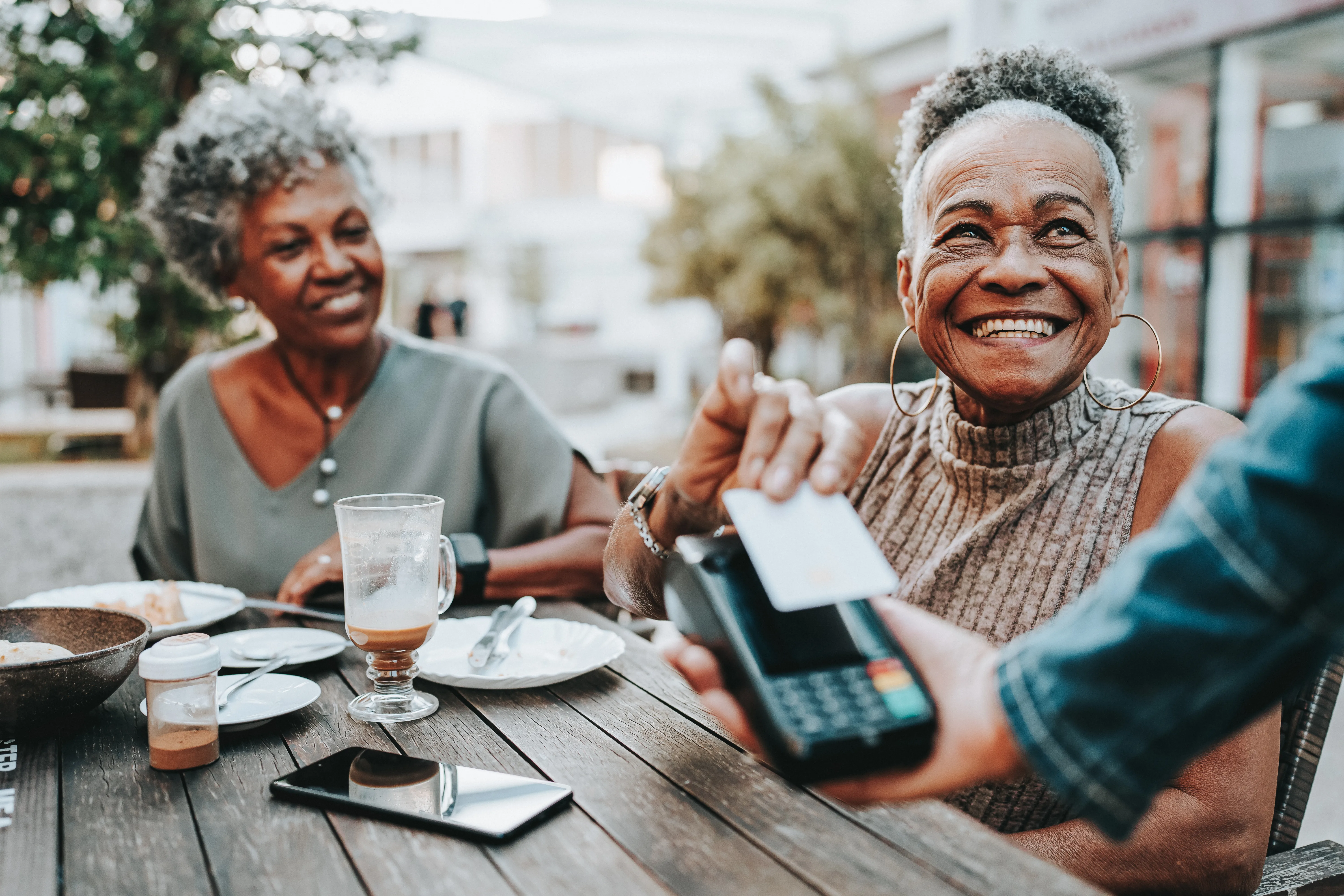 Senior woman making credit card payment 