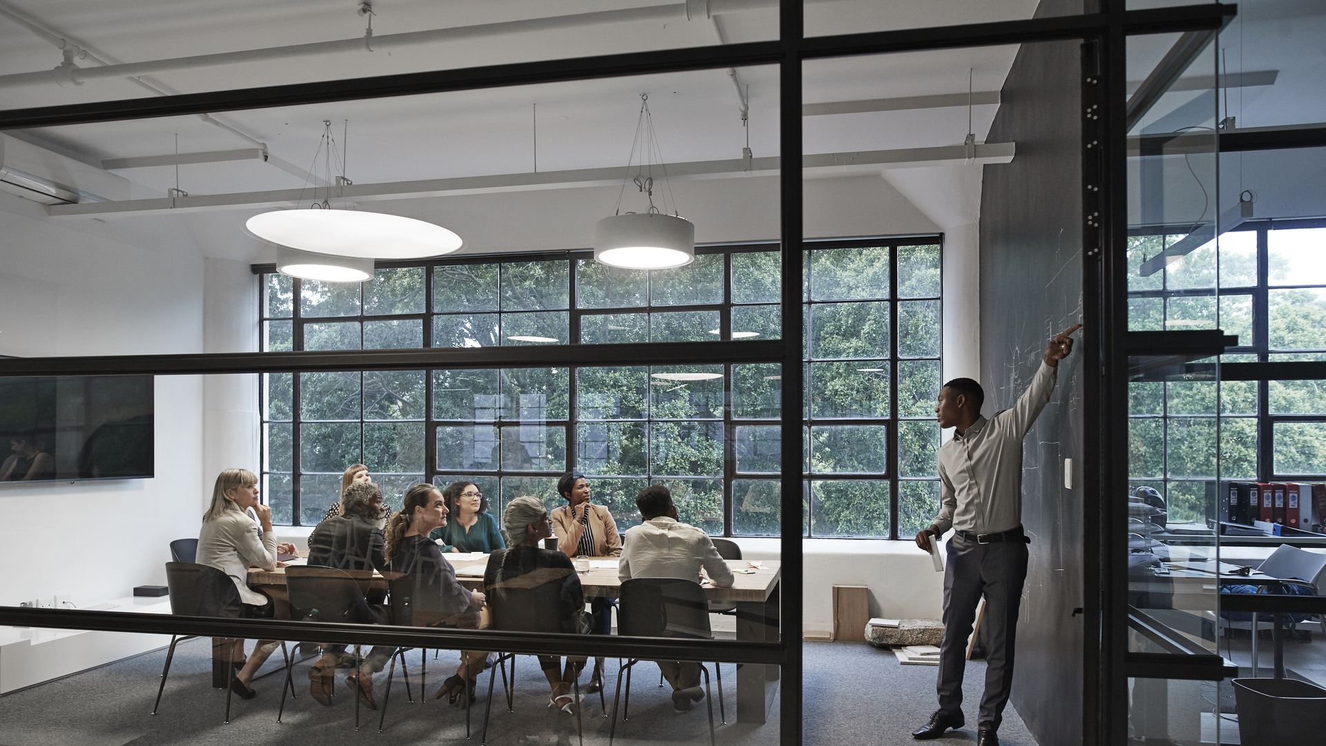 Businessman with coworkers in board room