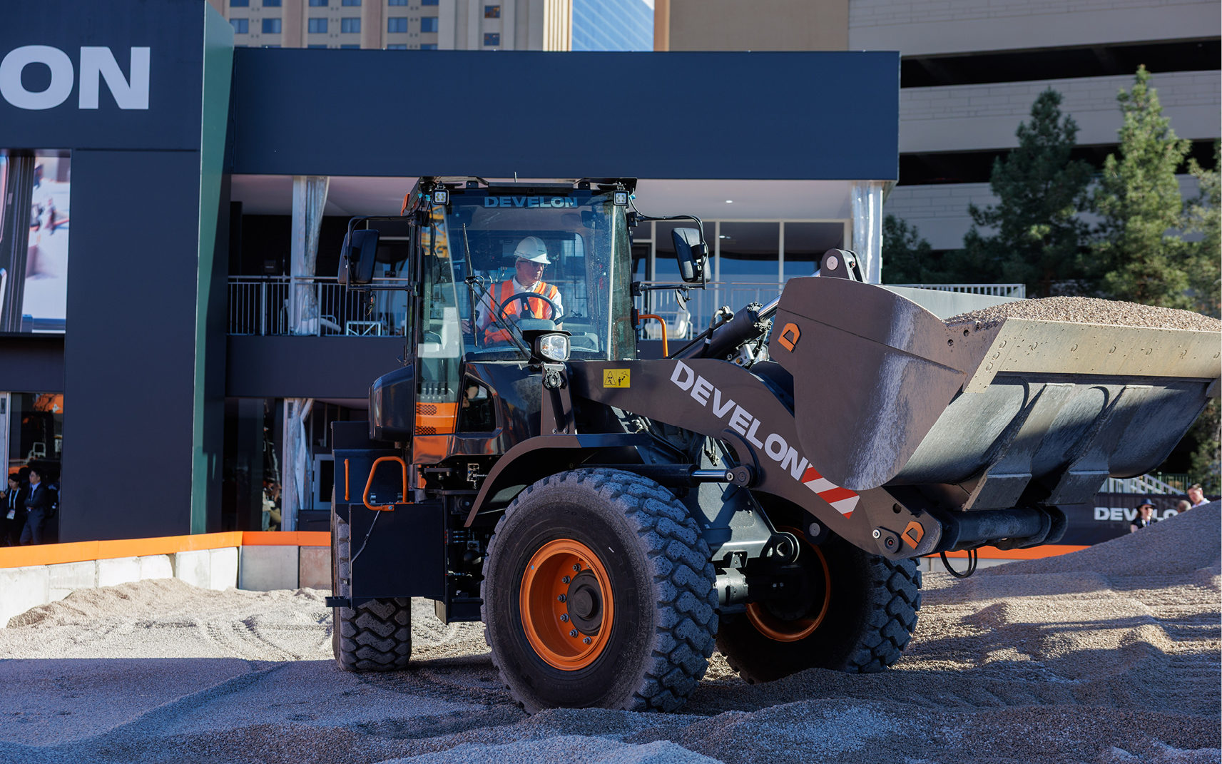 A DEVELON employee operates the DL220-7 wheel loader in the demo pit at CONEXPO-CON/AGG in Las Vegas.