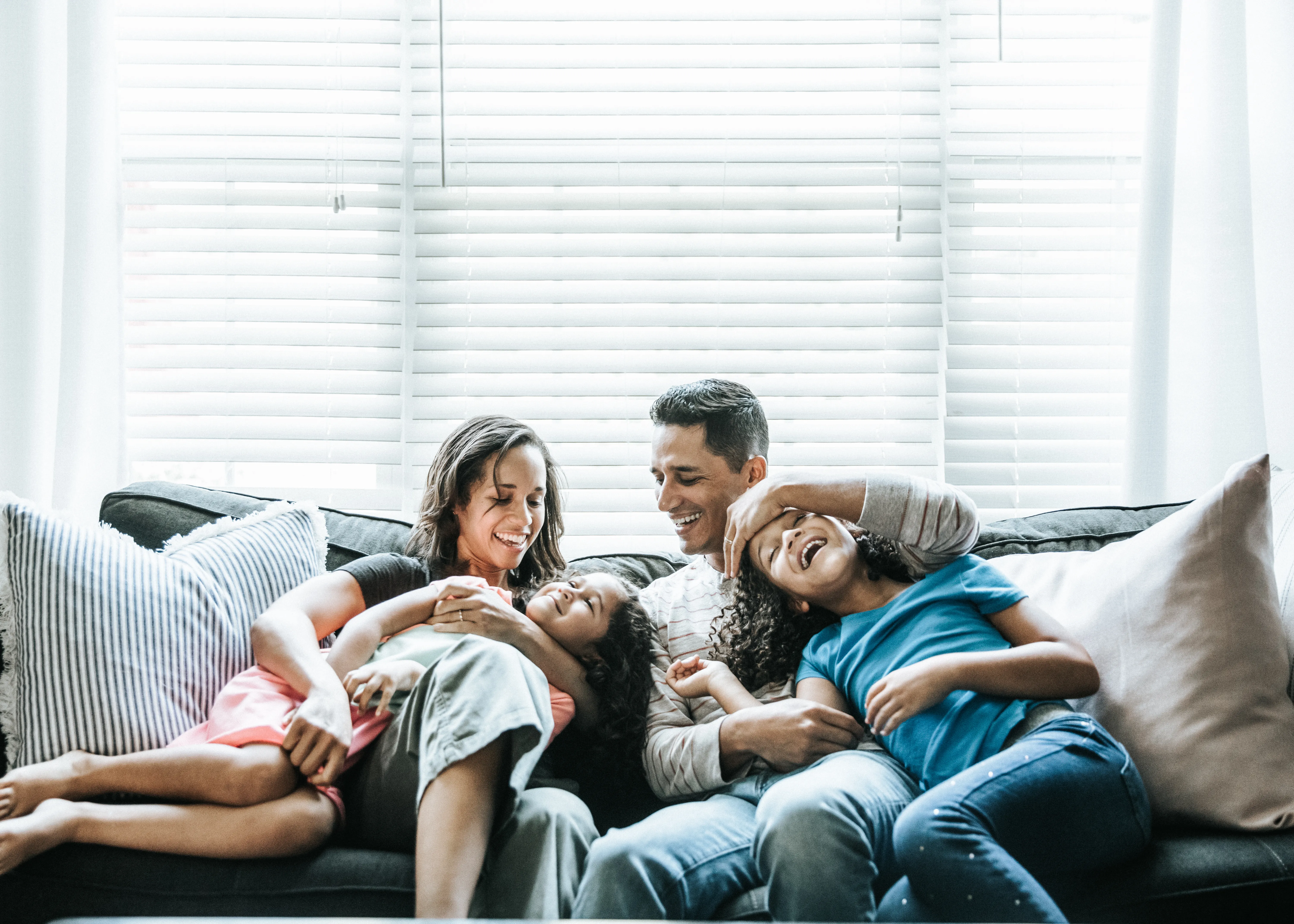 Portrait of young family of sofa at home 