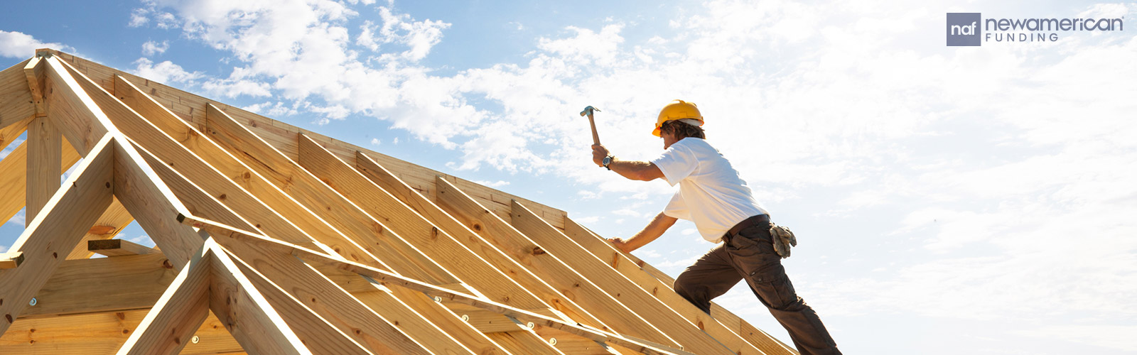 construction working building a roof for a new construction house