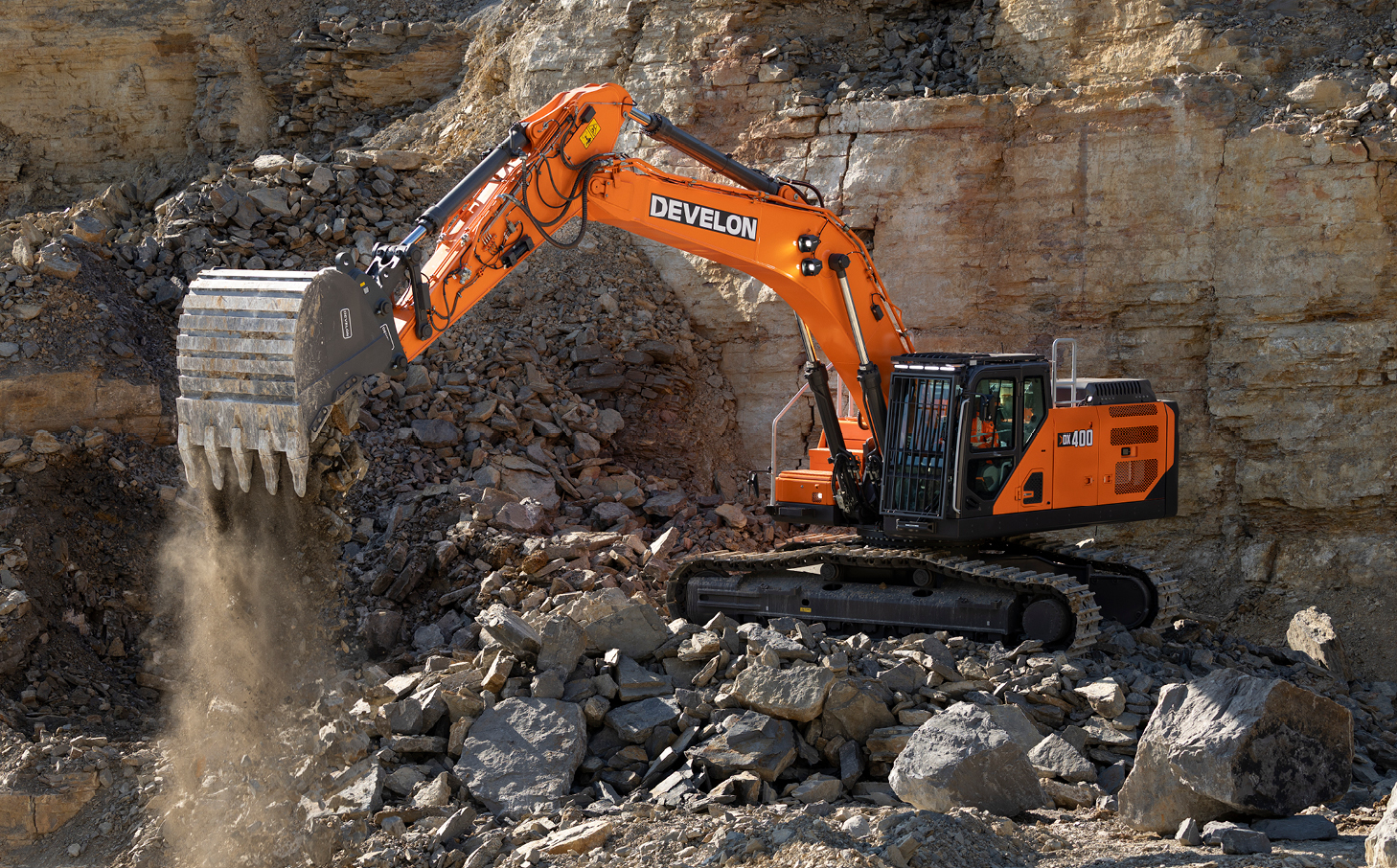 A DEVELON -9 Series crawler excavator working on a jobsite.