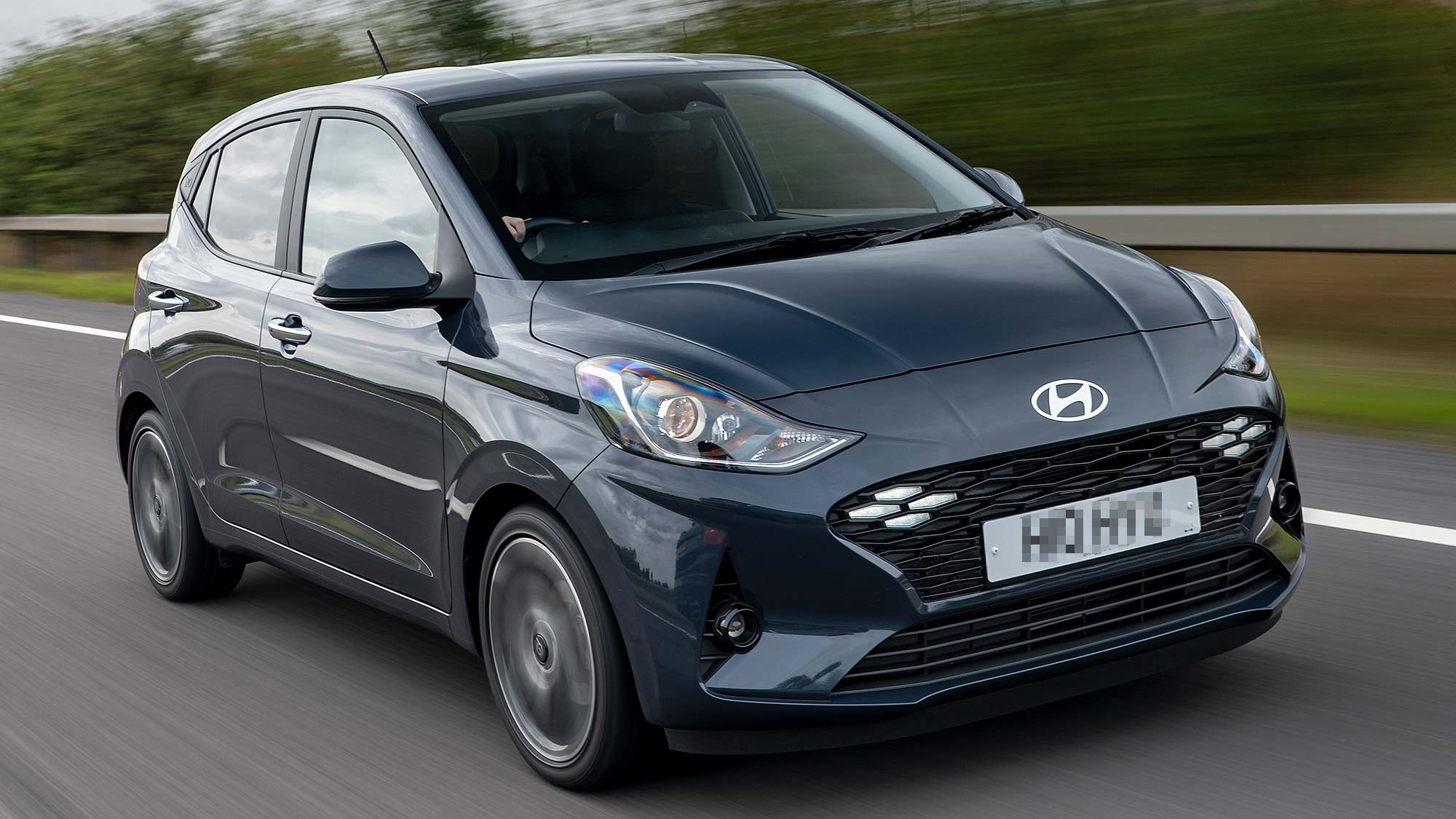 Grey Hyundai i10 driving on the road