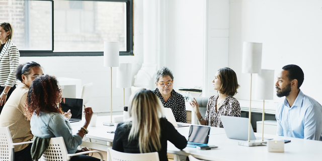 Businesspeople working in coworking office