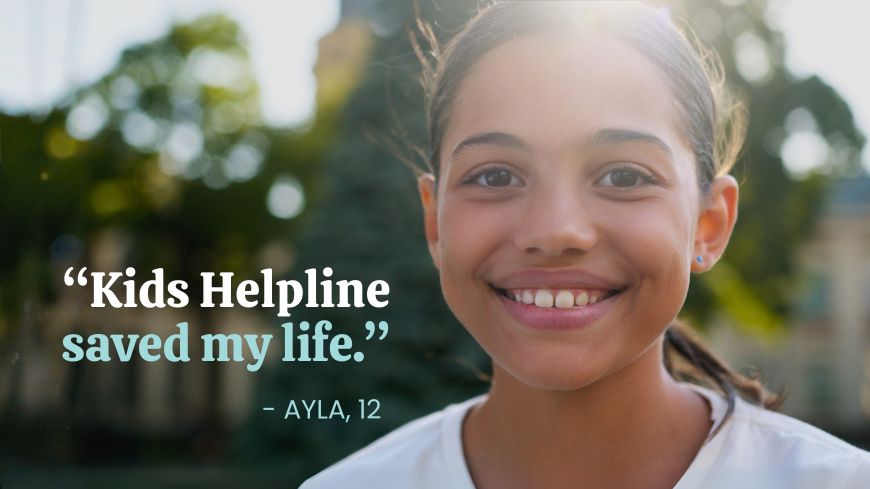 Young girl smiling at the camera with the quote 