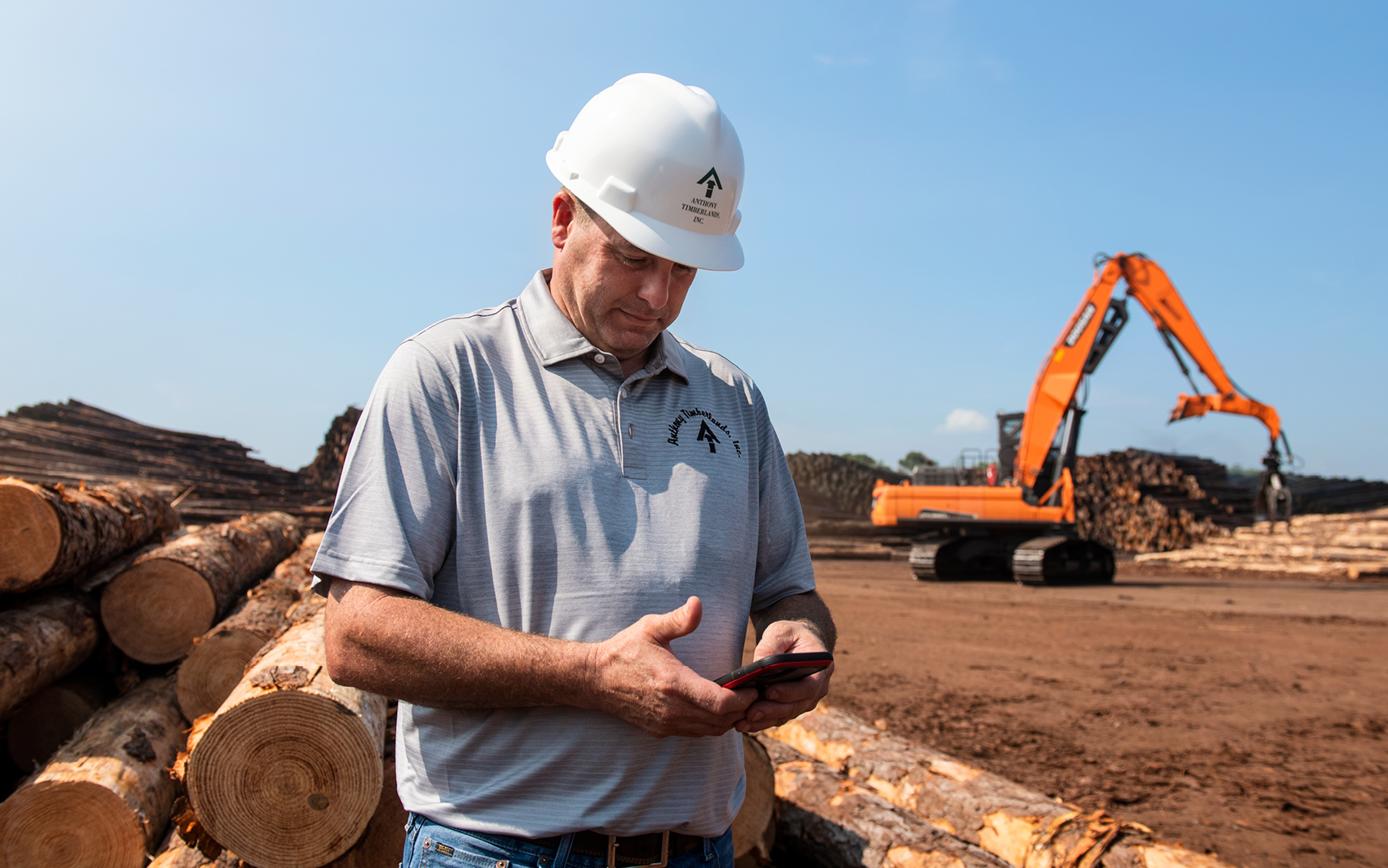 Anthony Timberlands employee David Whitson uses his smartphone to access the telematics app.