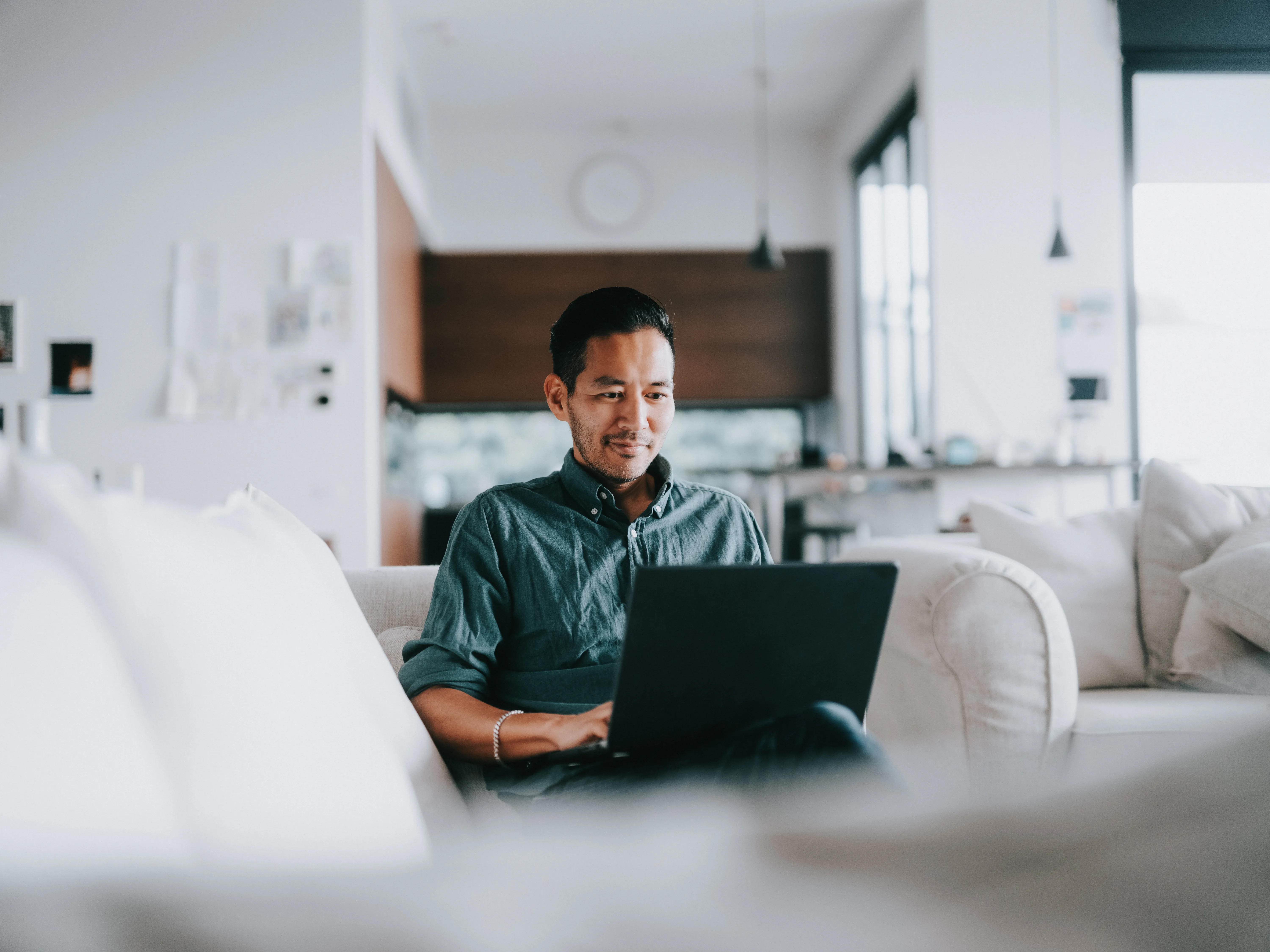 Man working with laptop at home 
