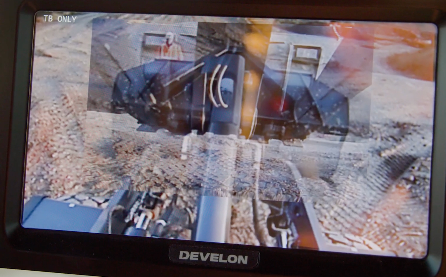 Wheel loader in-cab display shows the DEVELON Transparent Bucket feature, allowing an operator to see what the bucket is blocking.
