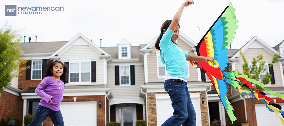 young girls flying a kite