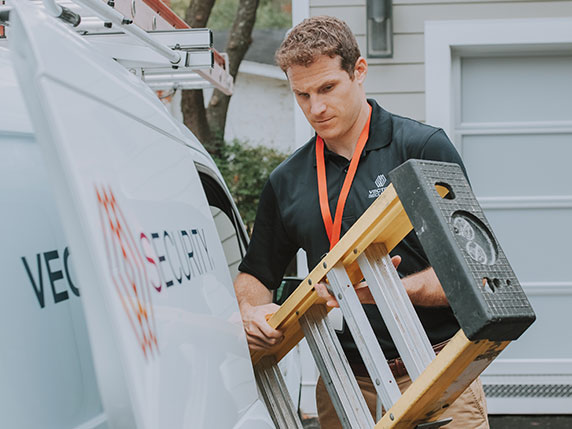 vector-security-technician-grabbing-equipment