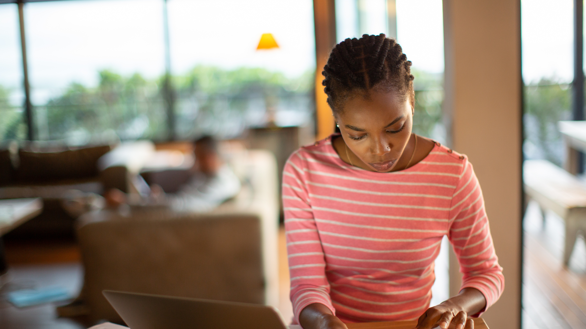 Young woman working on home finances