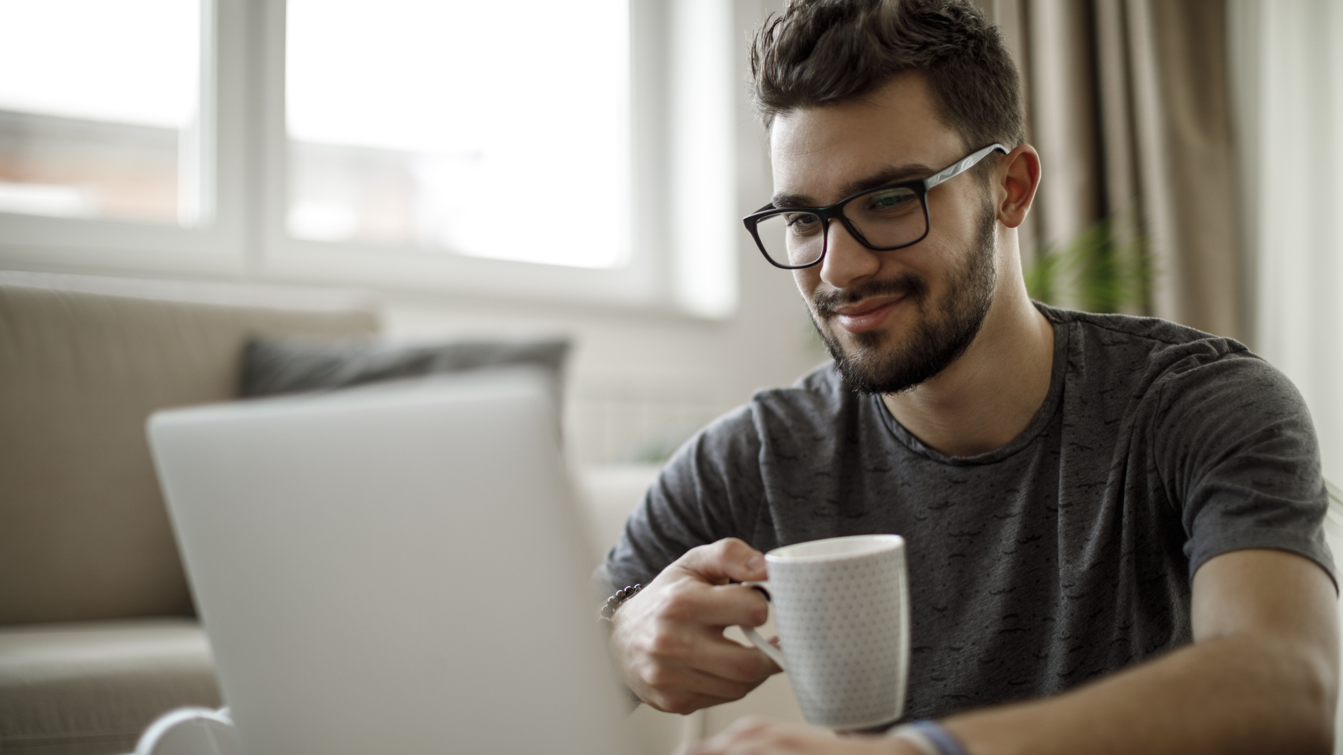 Young man using laptop at home