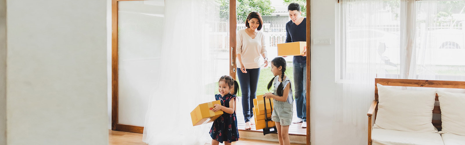 family with cute young girls moving into their new home