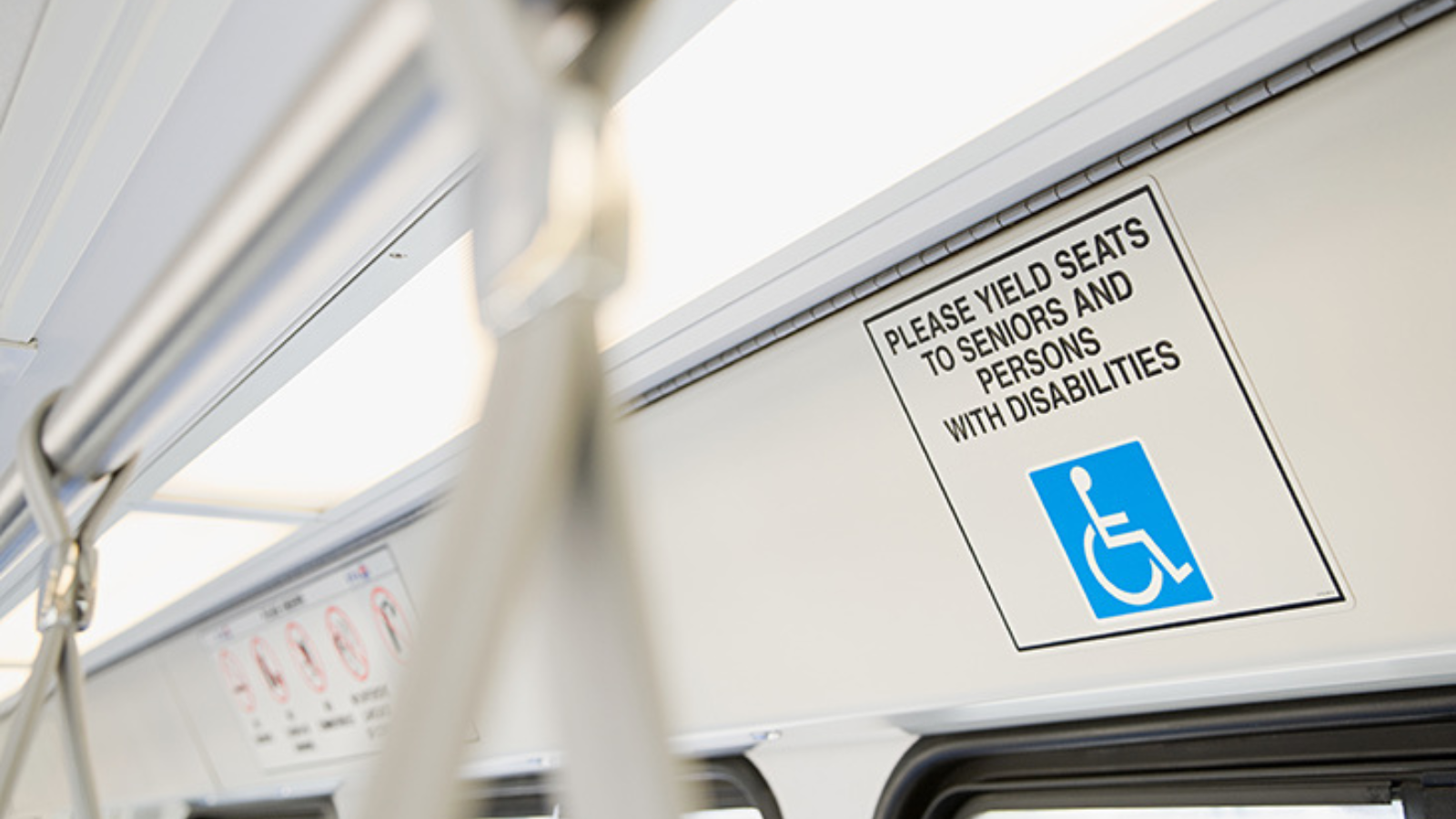 Sign of a priority seat area on a train