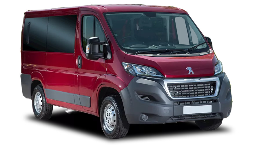 Front-side view of a red Peugeot Boxer van with black bumpers and trim, designed for large passenger or cargo transport.