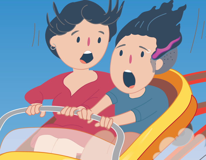 A mother and tween on a rollercoaster.