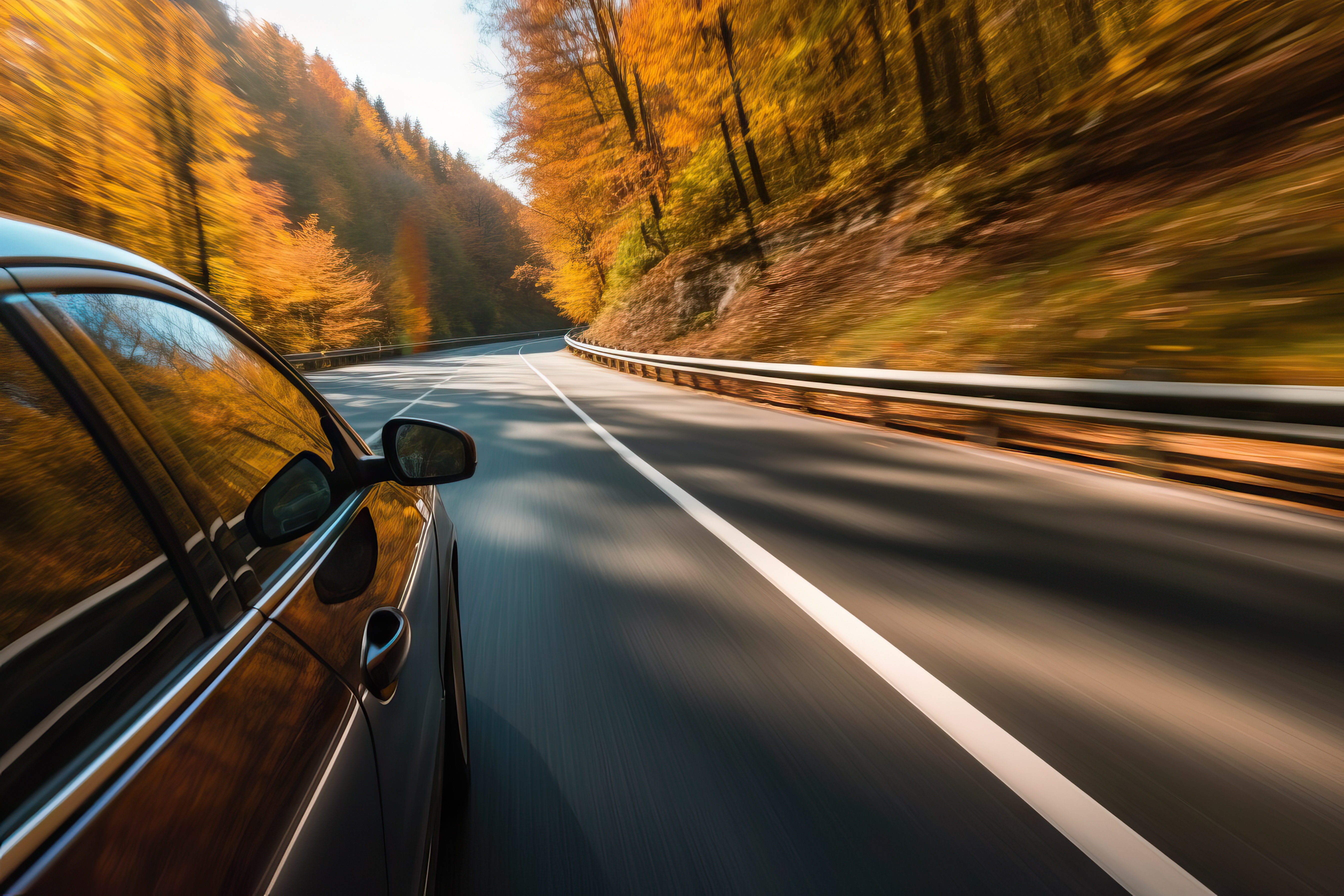Automobile on the highway with fall leaves