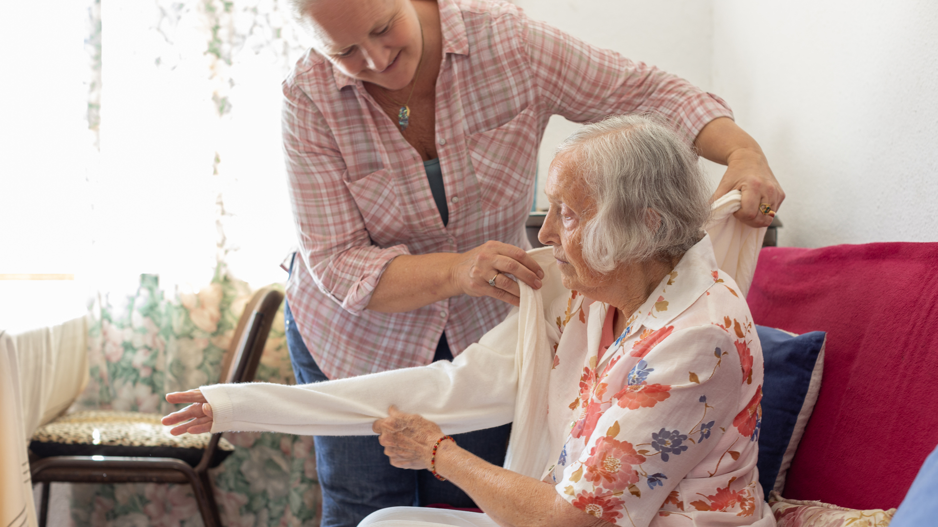 Mature woman caring for her elderly mother