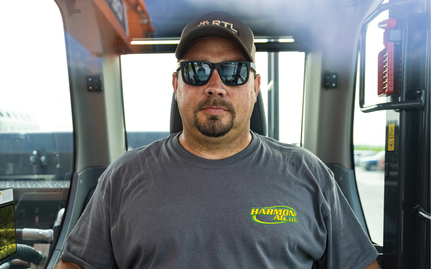 Michael Harmon, Harmon Ag, LLC, sitting in the cab of his DEVELON excavator.