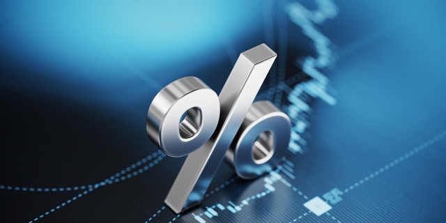 Percentage Sign Sitting over Blue Financial Graph Background - Stock Market and Finance Concept