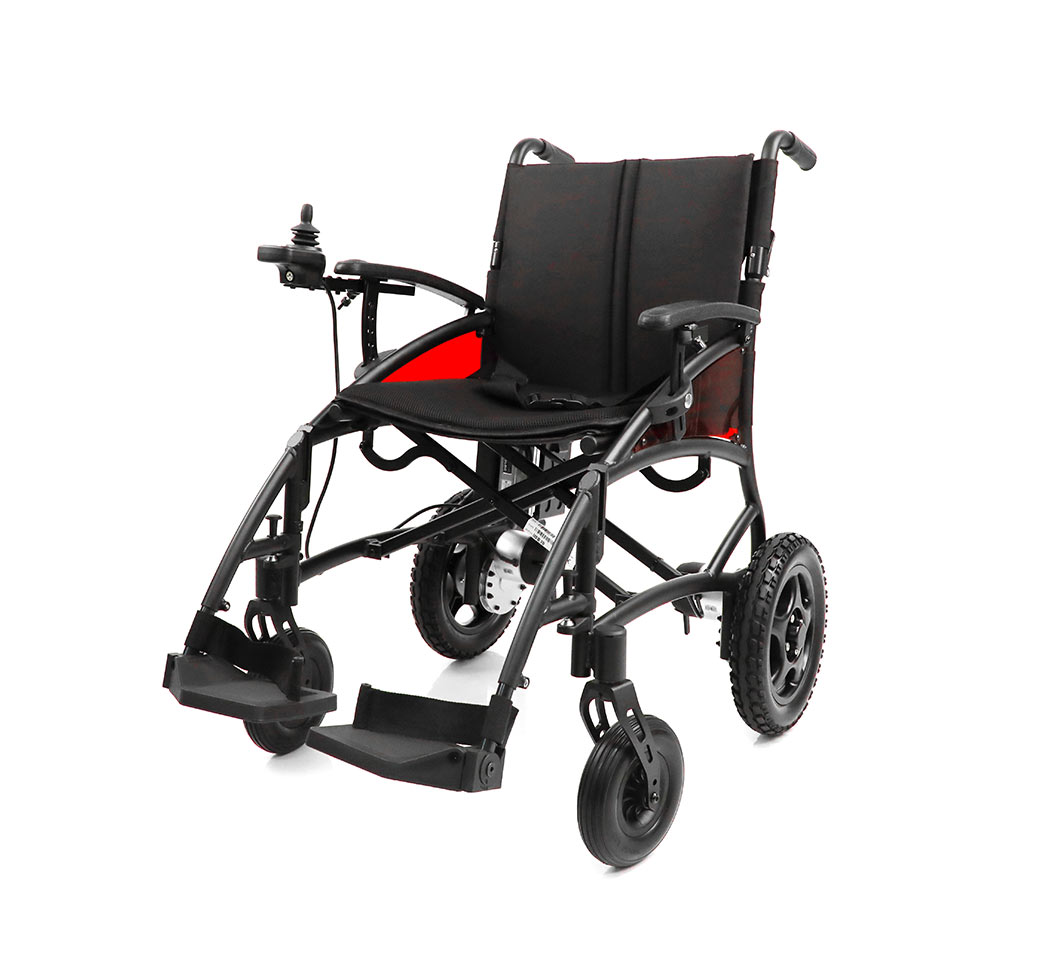A lightweight, black electric wheelchair with red side panels, joystick control on the left armrest, solid front casters, and larger rear wheels for indoor and outdoor use.