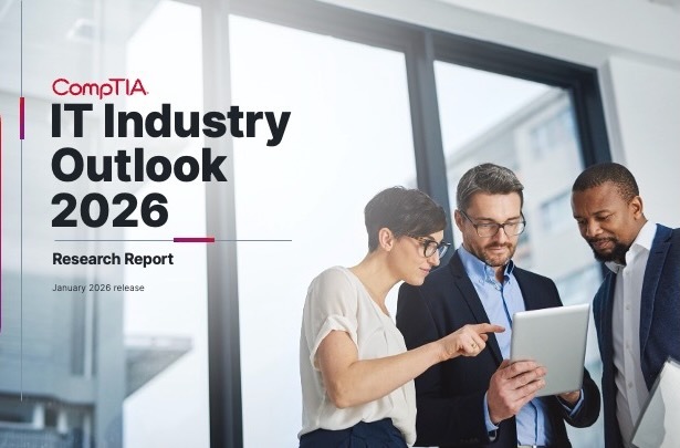 IT Industry Outlook 2026 - group of co-workers gathers around handheld device