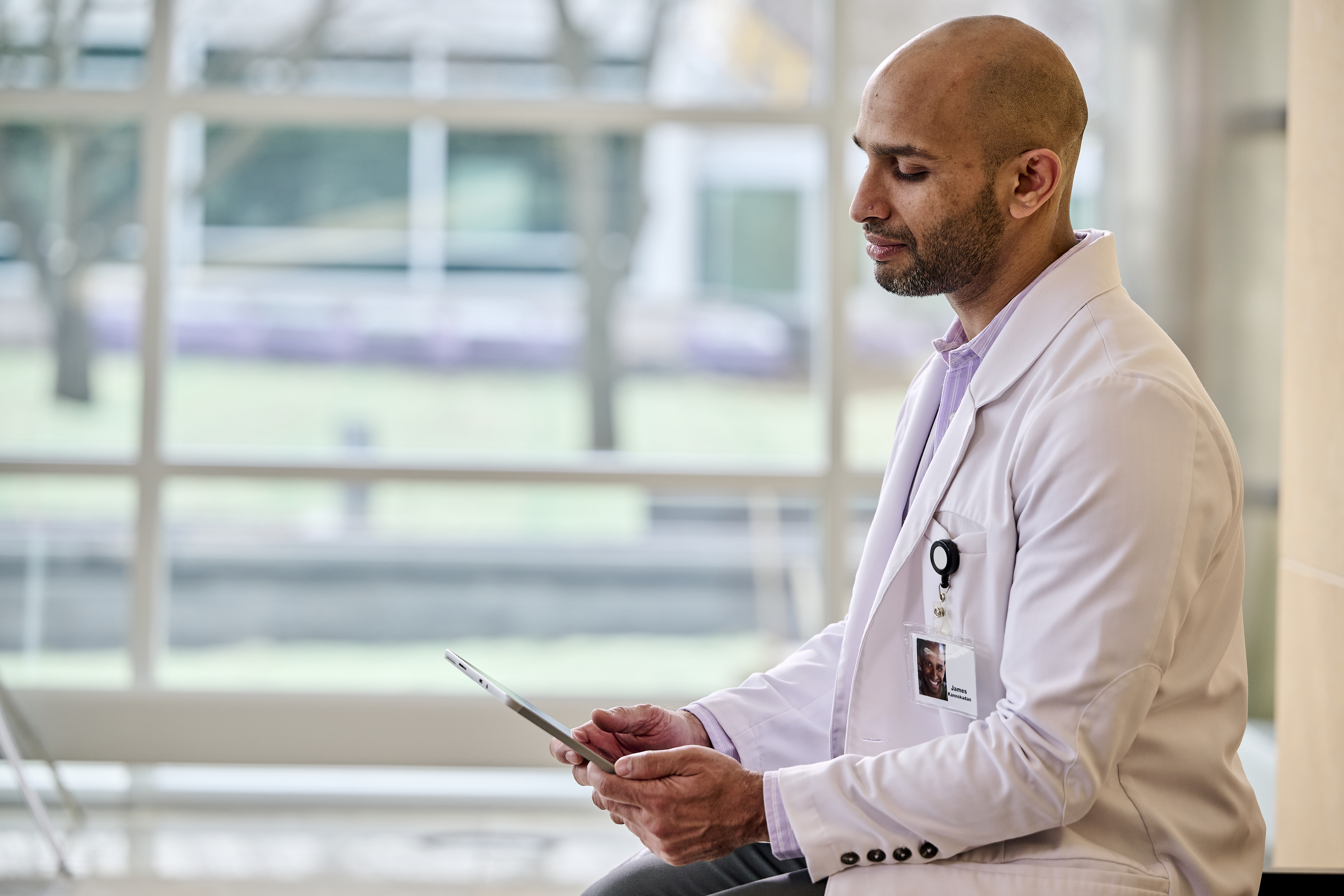 Radiologist looks at tablet