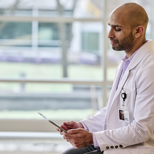 Radiologist looks at tablet