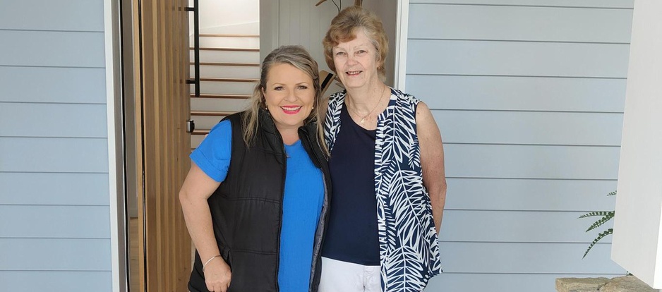 Prize Home Draw 482 winner Anwin standing with Jo
