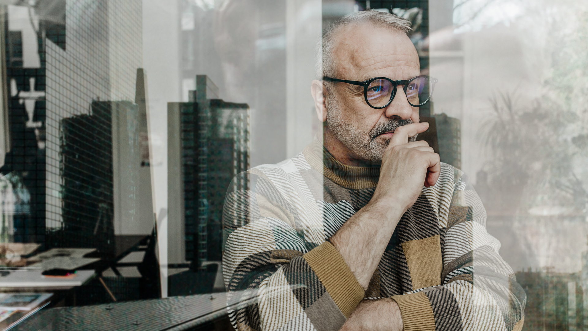 Senior man thinking by window