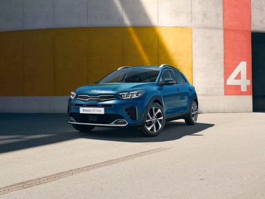 Blue Kia Stonic on its own in a car park